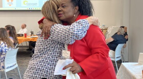 Sylvia Bennett-Stone, founder of Voices of Black Mothers United, embraces a well-wisher at UVA's third annual Gun Violence Prevention Summit.
