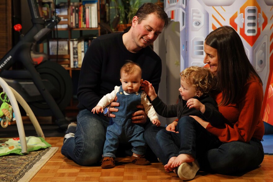 Rachel and David Berk with their children, 4-month-old Harper and 2-year-old Owen. The Berks will be moving into their new home in Pittsford in March.