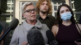 Nicole Reffitt talks to reporters outside of federal court in Washington, Tuesday, March 8, 2022. Her husband is Guy Wesley Reffitt, a Texas man who was convicted on Tuesday of storming the U.S. Capitol with a holstered handgun, interfering with police officers who were guarding the Capitol on Jan. 6, 2021, and for obstructing justice by threatening his two teenage children if they reported him to law enforcement after the Capitol attack. (Susan Walsh/AP)