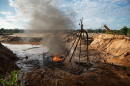 FILE - Members of the Peruvian Navy destroy a dredge used for illegal mining near the Malinowski River in the Tambopata National Reserve in Puerto Maldonado, Peru, Aug. 11, 2026. (AP Photo/Guadalupe Pardo, File)