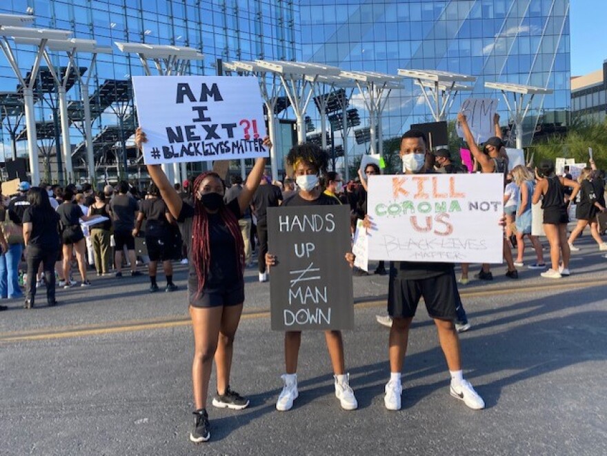 Three supports of black lives protest outside of Las Vegas City Hall. 