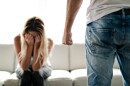 A man beating up his wife illustrates domestic violence.