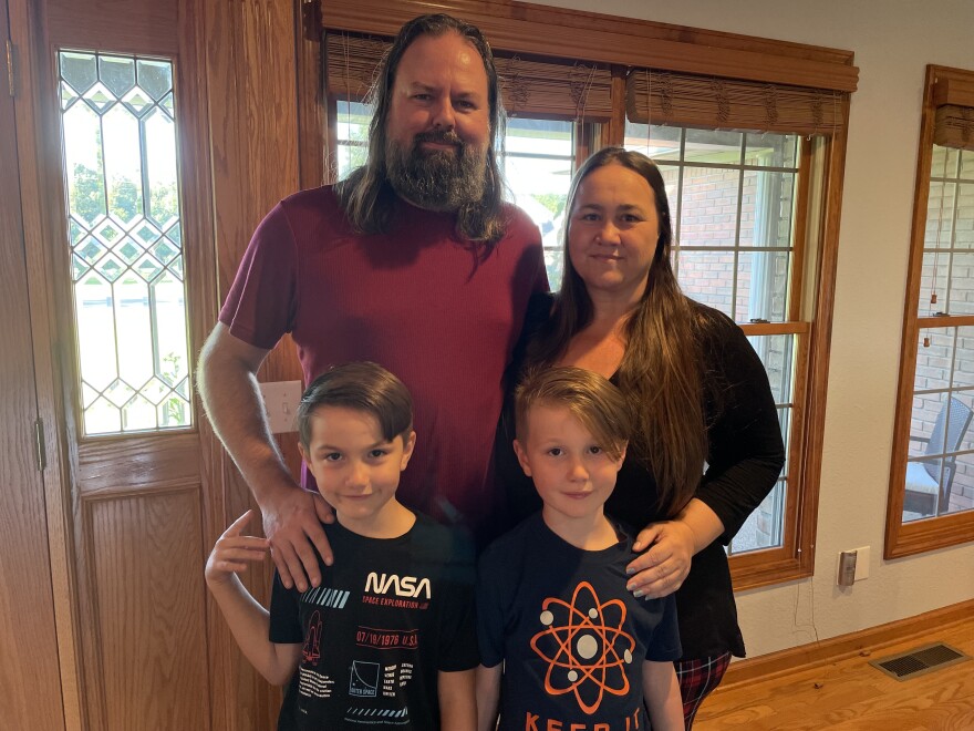 Kaja Lowe and Craig Lowe with their two children, Sitri and Lucian, at their western Kentucky home.