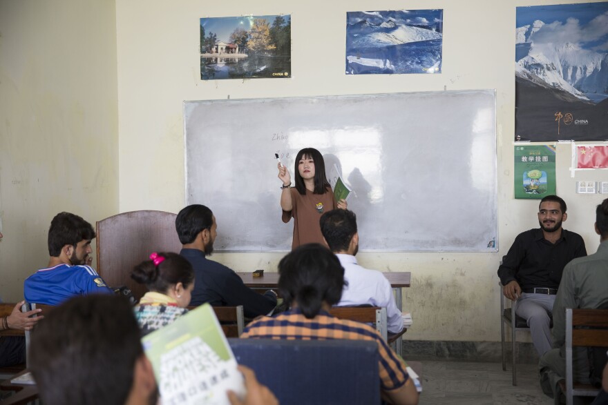 Zhou Xu is a volunteer teacher at a Mandarin class at the National University of Modern Languages in Islamabad. About 500 students are taking Mandarin, and the school has added morning and evening classes.