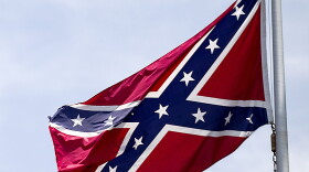 In this June 30, 2015 file photo, a Confederate flag flies at the base of Stone Mountain in Stone Mountain, Ga. 