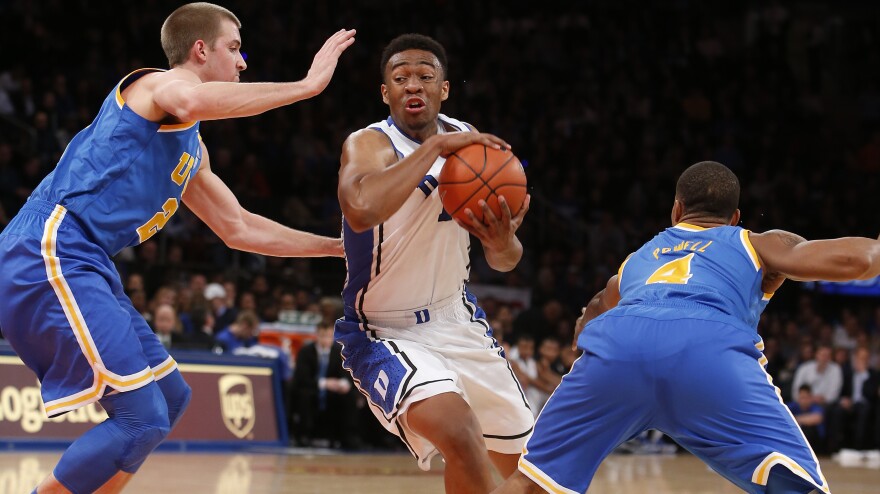 Duke's Jabari Parker weaves his way through UCLA players during a December game in New York.