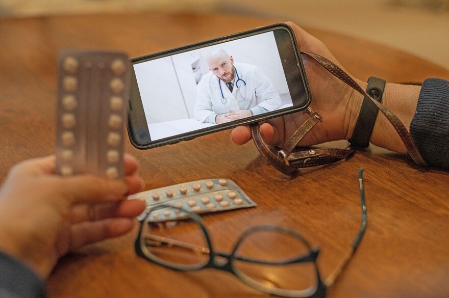 Patient talking to health care provider via phone.