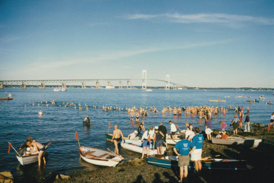 Traditionally, swimmers at "The Swim" were followed across the bay by row boats. Kayaks became more popular in the 2000s.