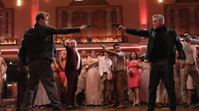 Brad Pitt and George Clooney in “Wolfs,” in theaters now and globally on Apple TV+ on September 27.