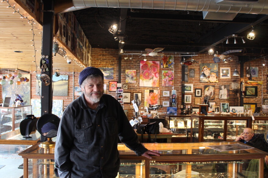 Anthony Williams pictured at his downtown Boyne City business, Freshwater Art Gallery. (credit: Maxwell Howard / Points North)