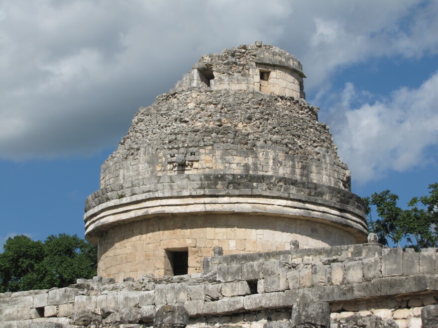 The crumbling ruins of a stone domed structure called Tz'iknal, also known as the Caracol or the Observatory, at the Chich'en Itza archeological site in the Yucatan Peninsula of Mexico.