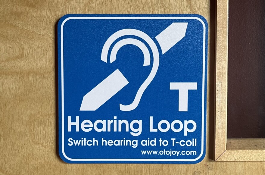 Hearing loops can broadcast to telecoils in a person's hearing aid or cochlear implant at the push of a button.