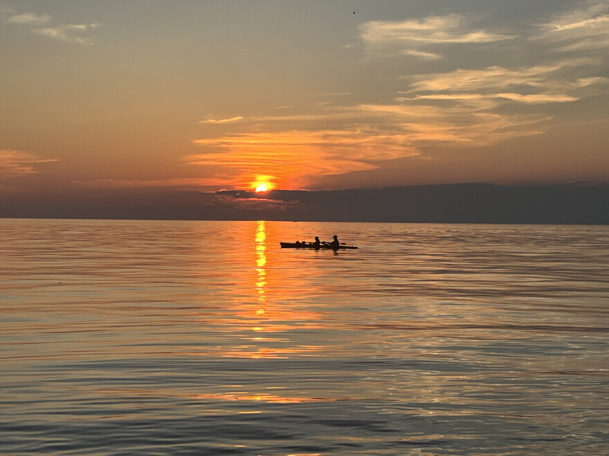 A pair of boaters at sunset on July 10, 2026, on Lake Ontario near Webster, New York.