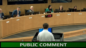 Board members listen as Melbourne High Sophomore Aiden Beard speaks during public comment.