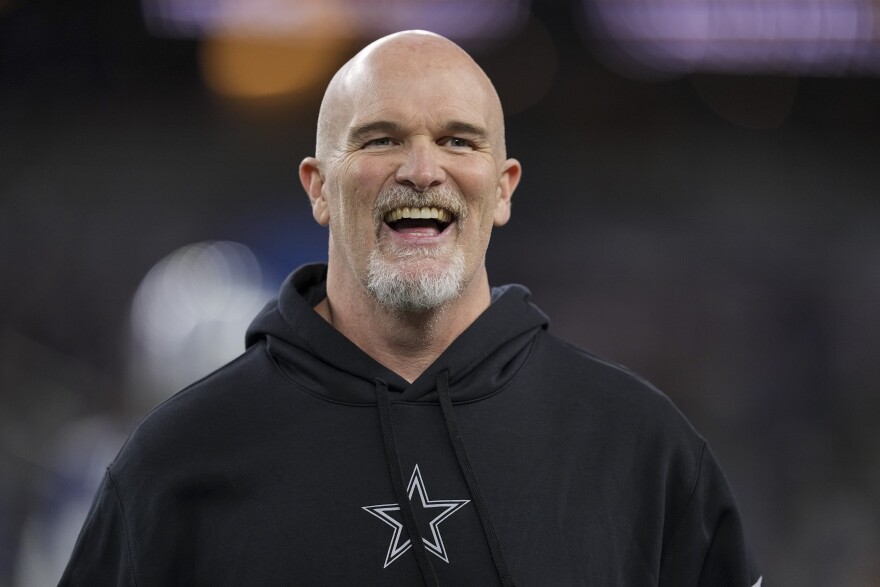 Dallas Cowboys defensive coordinator Dan Quinn looks on prior to an NFL football game against the Detroit Lions, Saturday, Dec. 30, 2023, in Arlington, Texas. The Washington Commanders have an agreement with Dallas Cowboys defensive coordinator Dan Quinn to hire him as coach, according to two people with knowledge of the decision. The people spoke to The Associated Press on condition of anonymity Thursday, Feb. 1, 2024, because the team had not yet announced the move.