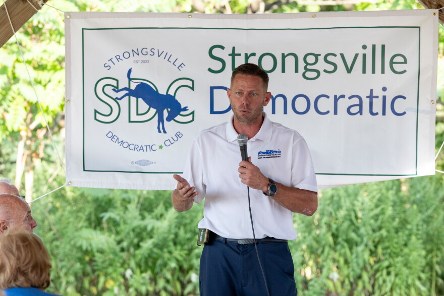 FILE - Brian Poindexter, Democratic nominee for Ohio's 7th congressional district, speaks at the Strongsville Democratic Club meeting, Aug. 5, 2026, in Strongsville, Ohio.