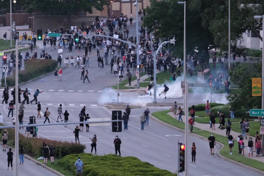 The scene at Main Street and Cleaver II Boulevard after police began scattering the crowd with tear gas.