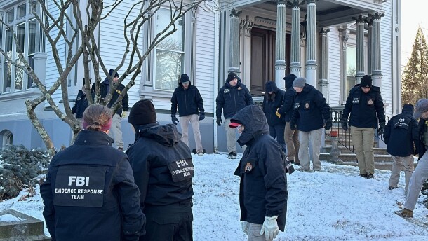 FBI officials search an area of Providence, R.I., Monday, Dec. 15, 2025. (AP Photo/Leah Willingham)
