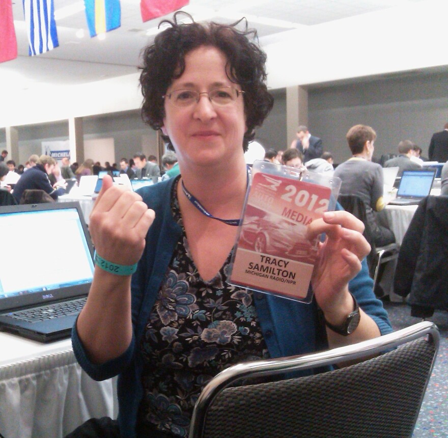 Michigan Radio Auto Reporter Tracy Samilton shows off her coveted credentials.