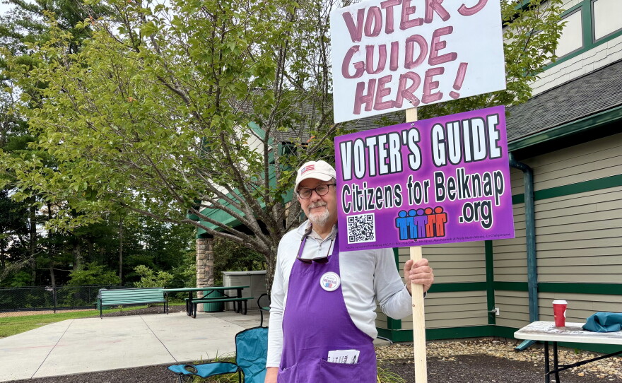 Brian Beihl, of the nonpartisan Citizens for Belknap, hands out voter’s guides at the polls in Meredith. He said several Republican candidates declined to attend the group’s candidate forums or answer its questionnaire.