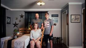 Tres Biggs with his wife, Heather, and son, Lane, at their home. 