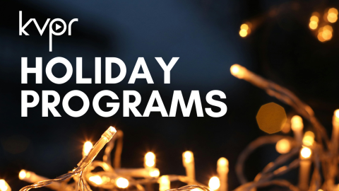 A string of twinkling white lights on a black background.