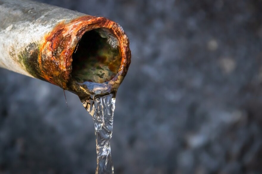 stock photo of water coming out of a pipe