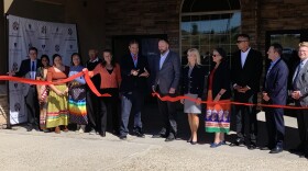 Dr. Warne cuts the ribbon on the newly-opened facility