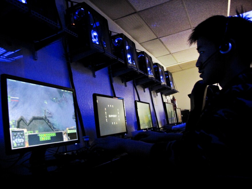 Eric Lee plays a massively multiplayer online game at Euphnet, a cybercafe for gamers in Sunnyvale, Calif. The $30 billion video game industry is driving new, faster chip designs that are now powering some of the world's most powerful supercomputers.