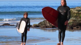 Matt Allen conducts a surfing lesson with 11-year-old Ray Goodson on the beach in Encinitas, Cal. At the age of 41, Allen is enlisting in the Navy under a new rule that raises the maximum age for Navy recruits.