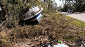A boat that was washed onto a residential street from the storm surge stands in the aftermath of Hurricane Helene, in Steinhatchee, Fla., Saturday, Sept. 28, 2024.