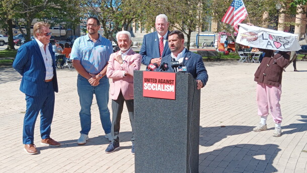 Erie County Republican Committee Chair Michael Kracker speaks in advance of a visit to Buffalo by influential New York City Democrat Alexandria Ocasio-Cortez. Joining him are, from left, Assembly candidate Frank Bogulski, former professional boxer and Democrat Joe Mesi, Erie County Conservative Chair Ralph Lorigo, and Assembly candidate Terry McGuire. A lone protestor showed up during their event.