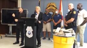 A woman speaks at podium.