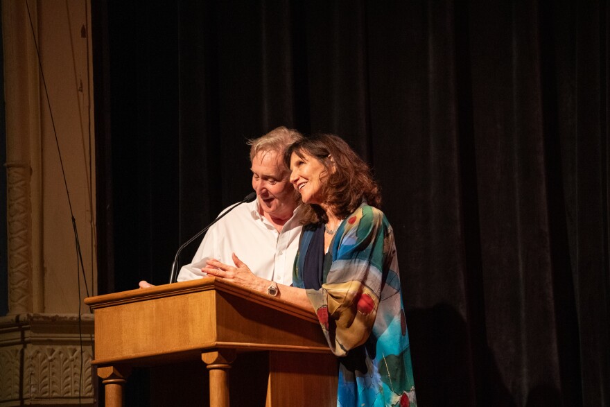 Anne Stanton, with her husband Doug Stanton, speaking at the National Writers Series — an institution they helped build in Traverse City. Stanton is retiring in September, after 17 years. (Photo courtesy of the National Writers Series)