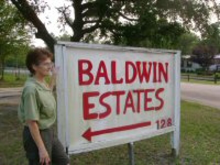 Park Manager Virginia Janelle stands beside the entrance of Baldwin Estates. She wants the town to give the residents more time to find new homes.