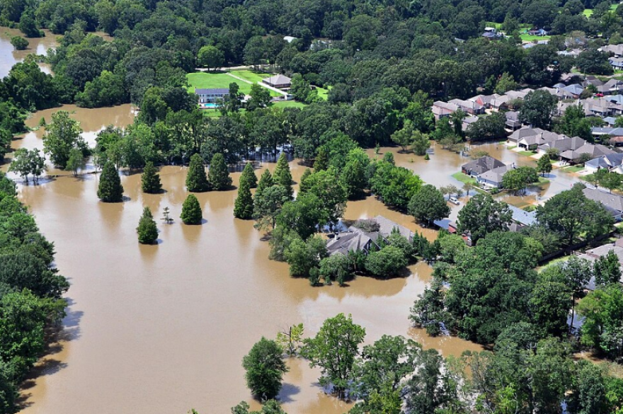 An aerial view taken from an MH-65 Dolphin helicopter shows severe flooding in a residential area of Baton Rouge, LA on Aug. 15, 2016. Coast Guard photo by Petty Officer 1st Class Melissa Leake.
