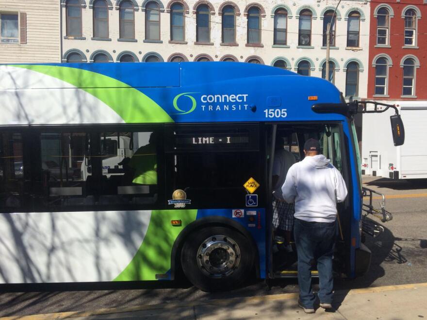 People getting on a bus