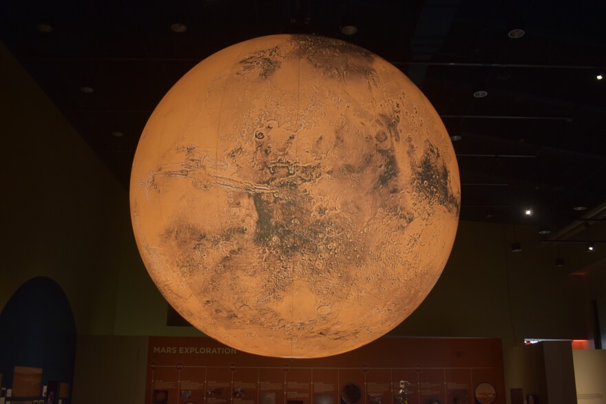A 10-foot illuminated model of Mars created by British artist Luke Jerram is the centerpiece of the Peoria Riverfront Museum's new exhibit around the Red Planet. The model was sponsored by Sheldon and Mary Ann Schafer.