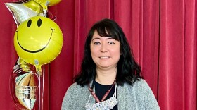 Tama Lang, Litwin Elementary school's guidance counselor, accepting her award as counselor of the year during a surprise announcement at the elementary school. 