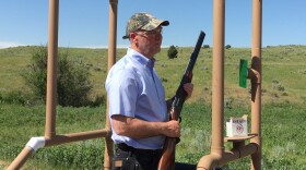  In this undated photo from 2016, Greg Gianforte holds a shotgun.