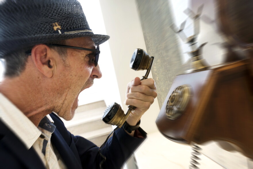Caller on on old fashioned telephone.