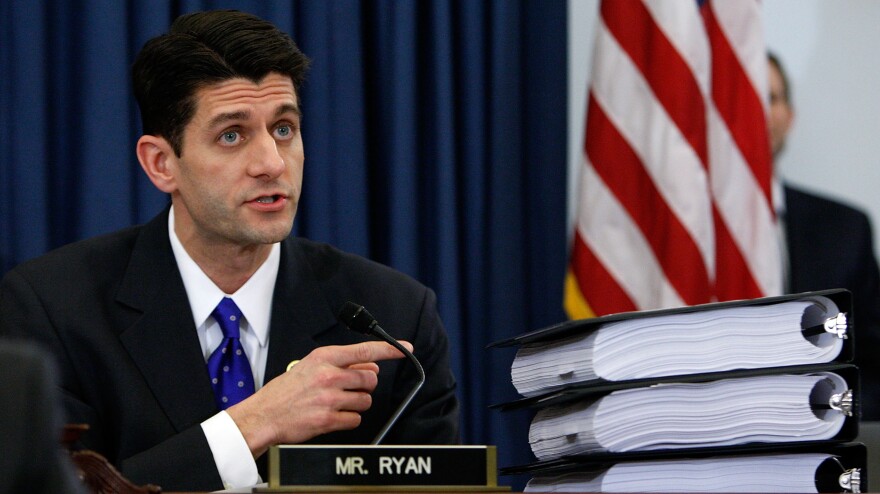 Rep. Paul Ryan, R-Wis., points to piles of the health care overhaul legislation during a markup hearing before the U.S. House Budget Committee last year in Washington, D.C.