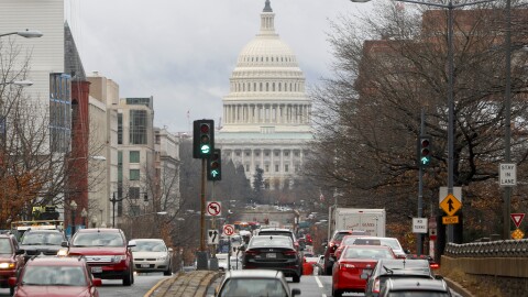 Commuter traffic on North Capitol Street heading towards the US Capitol Building in Washington resumes to its normal volume, Tuesday, Jan. 23, 2018. The bill to reopen the government late Monday, was signed by President Donald Trump, ending a 69-hour display of partisan dysfunction. (AP Photo/Pablo Martinez Monsivais)