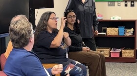 Kristen Sickler, Rochester School for the Deaf alumna and author of the book Siren of the Finger Lakes, presents at an alumni panel discussion with current students at the school's library on Friday.