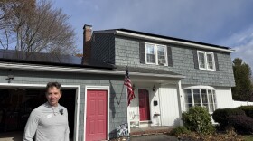 Aaron Wallin worked with ReVision Energy to install a large solar array on the roof of his Hampton home. He's still connected to the grid as a backup, but it generates enough electricity to power his whole house.