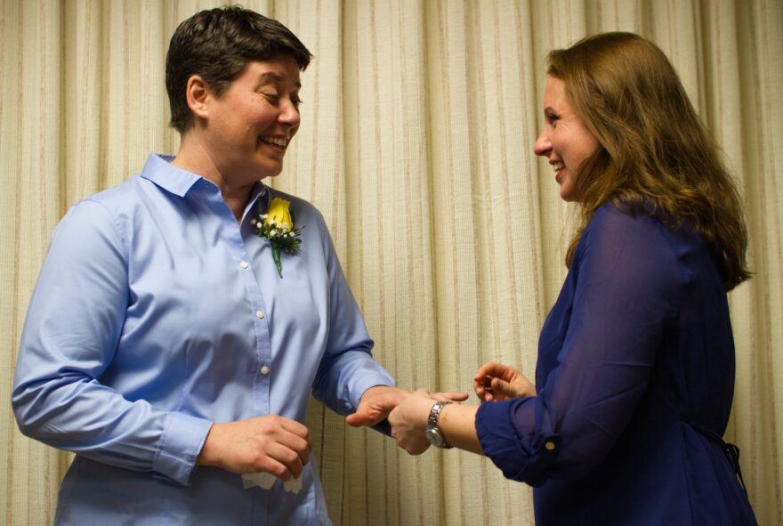 Elizabeth Rodgers places a ring on Jodi Hall's hand during their wedding ceremony at the Alachua County Courthouse Tuesday, Jan. 6. Alachua County issued 28 same-sex marriage licenses Tuesday after Florida's ban on same-sex marriage was lifted at midnight.