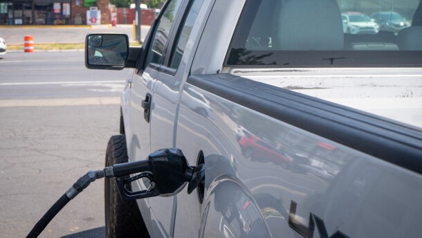 A truck fills up at a gas station in Salt Lake City. Fuel prices are still averaging almost a dollar more per gallon than last year.