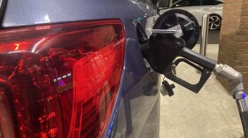 A customer pumps gas in Columbus.