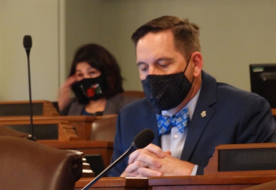 Republican Rep. Tim Butler, front, and Democratic Rep. Lisa Hernandez listen to testimony Wednesday during a meeting of the House Redistricting Committee.