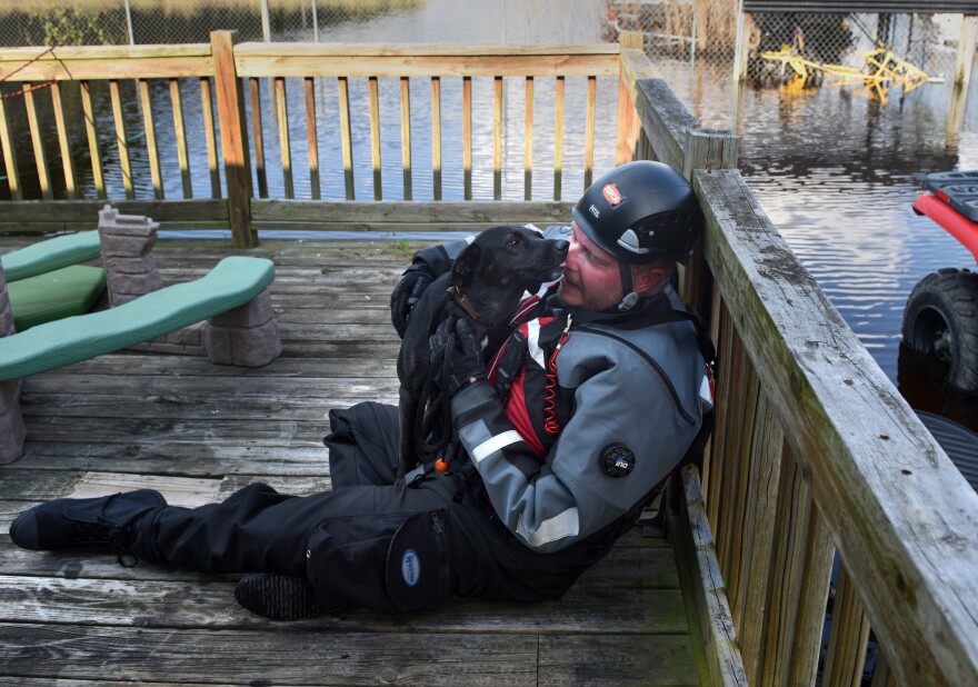 Leath has become known among fellow rescuers as the "dog whisperer" because of his skill at comforting frightened canines.